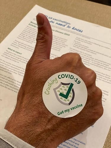 Dr. Karkare doing his part in stopping the pandemic by getting vaccinated for Covid-19.